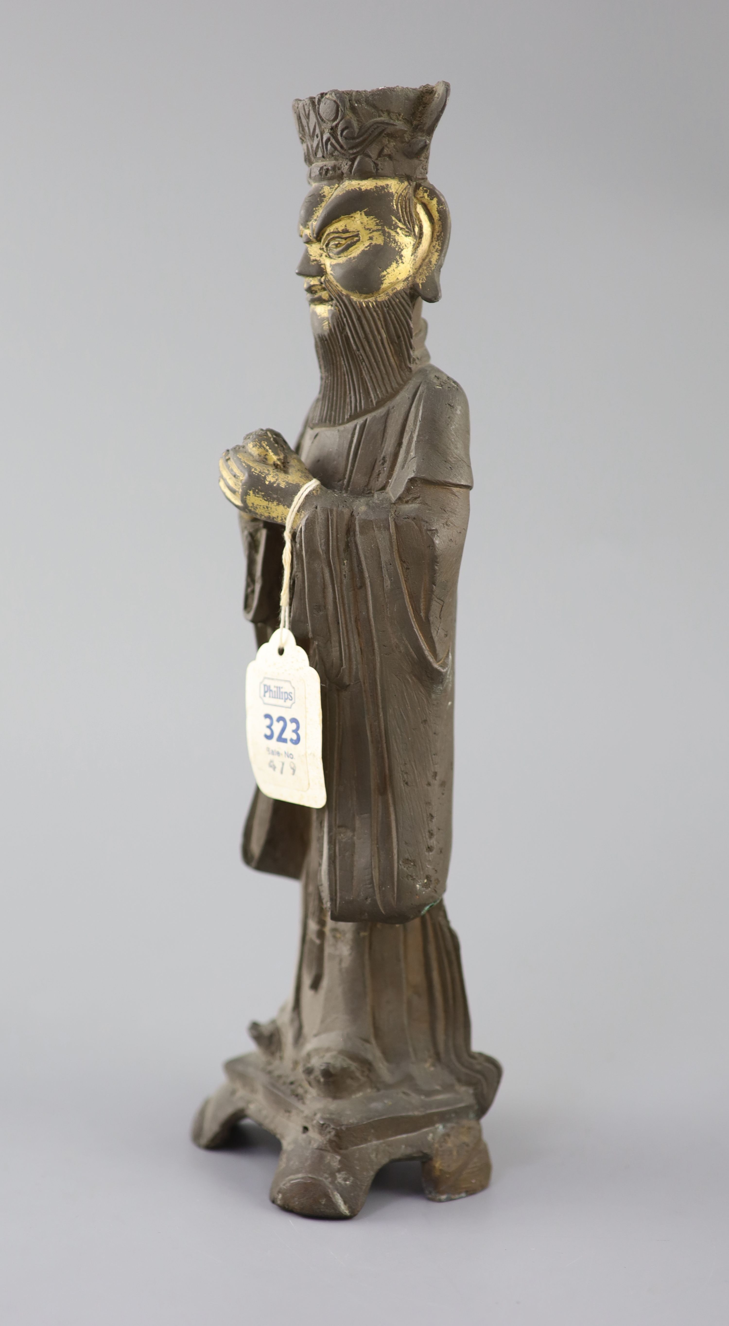 A Chinese bronze standing figure of an Emperor, late Ming dynasty, 30cm high, losses, Provenance - A. T. Arber-Cooke